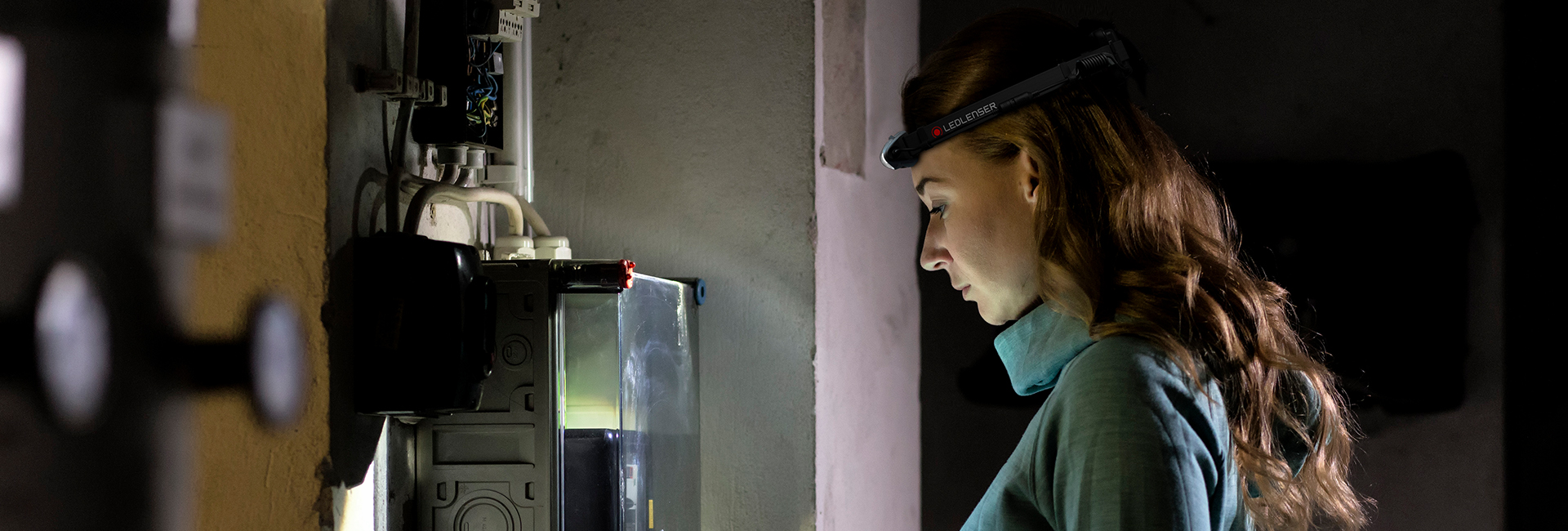 A woman with a headlamp
