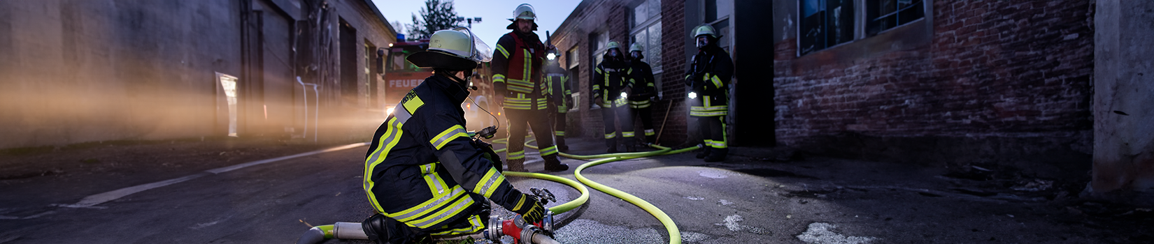 Firefighters with flashlights at work