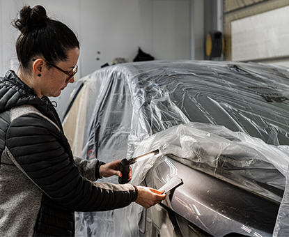 A woman using a Ledlenser Work Light