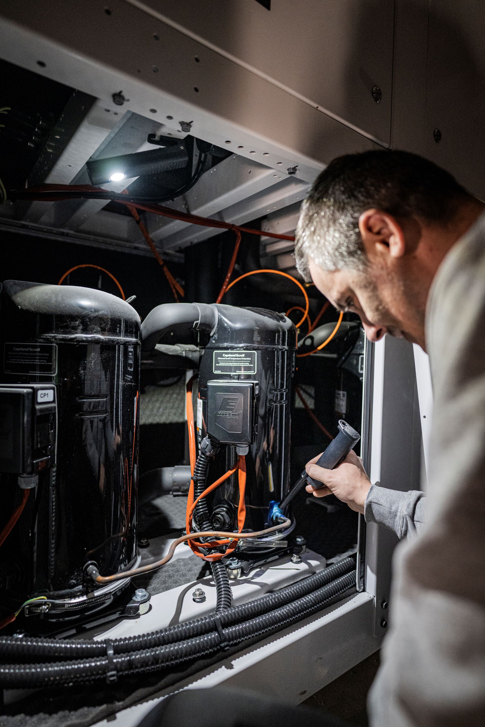 An electrican using a work light
