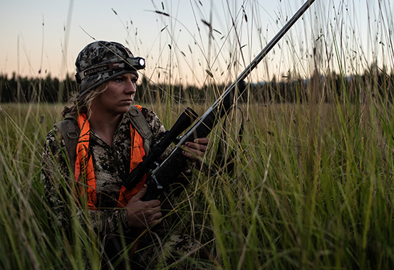 A hunting woman with a headlamp